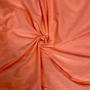 2 yards of peach/coral jersey knit, 95% cotton, 56 inches wide, 4-way stretch